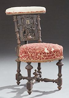 French Fumed Carved Oak Prie Dieu, c. 1870, the upholstered armrest over a backsplat with a central shield monogrammed "PB" o