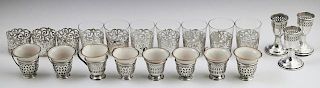 Group of Twenty-One Sterling Overlay Pieces, early 20th c., consisting of ten shot glasses, #3561, seven with the glass inser
