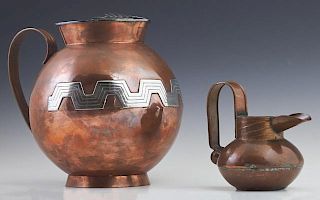 Two Mexican Copper Pitchers, 20th c., consisting of a small example by William Spratling, #349, with a tall strap handle, the