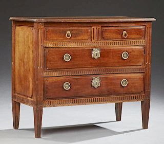French Louis XVI Style Carved Walnut Commode, 19th c., the stepped edge top over two frieze drawers above two long drawers, f