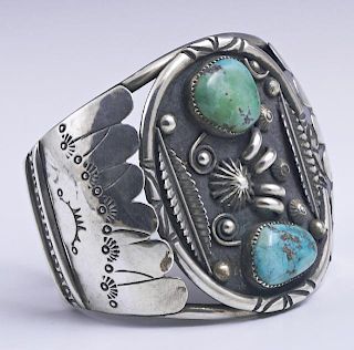 Native American Turquoise Silver Cuff Bracelet, 20th c., by Robert and Berneice Leekya, the wide center with an oval medallio