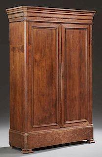 American Pine Armoire, 19th c., possibly New Orleans, the stepped ogee crown above two paneled doors, on a plinth base with a