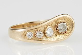 Lady's 14K Yellow Gold Dinner Ring, the curved top mounted with four channel set graduated diamonds, total diamond weight- ap