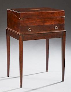 English Style Inlaid Mahogany Fold Over Desk, 20th c., the lifting back with a stationary rack and open storage, the front fo