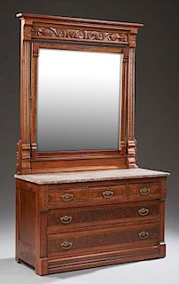 American Aesthetic Carved Walnut Marble Top Dresser, c. 1880, with a stepped ogee crown, over a wide beveled swivel mirror, o