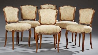 Set of Six French Louis XV Style Carved Beech Dining Chairs, 19th c., the serpentine arched shield backs over bowed seats, on