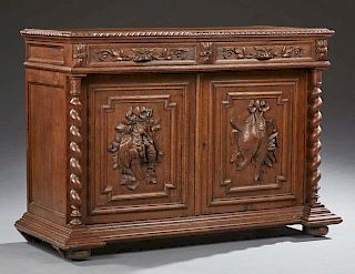 French Jacobean Style Carved Oak Sideboard, 19th c., the rectangular stepped top over two frieze drawers above double setback
