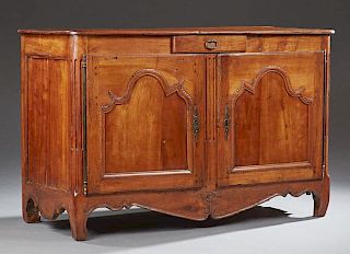 French Provincial Louis XV Style Carved Cherry Sideboard, early 19th c., the rounded corner top over a central frieze drawer 