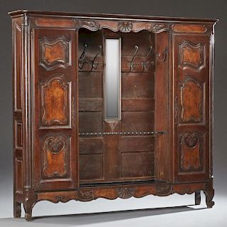 French Louis XV Style Carved Cherry and Elm Hall Stand, 19th c., the stepped ogee edge crown over a center with wrought iron 