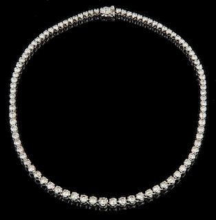 Platinum Tennis Necklace, each of the 93 links with a graduated round diamond, total diamond weight- 16.37 cts., L.- 17 in., 