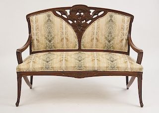 ART NOUVEAU CARVED MAHOGANY SETTEE, IN THE STYLE OF LOUIS MAJORELLE