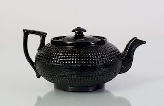 ENGLISH BLACK-GLAZED PORCELAIN CANE-WARE TEAPOT AND COVER