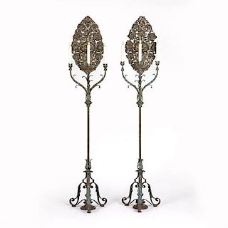 A pair of Spanish Colonial style cast iron three light torchieres