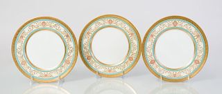 SET OF EIGHT CAULDON CUSTARD AND TURQUOISE-GROUND PORCELAIN PLATES RETAILED BY TIFFANY & CO.