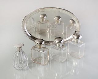 SHREVE STERLING SILVER TRAY WITH FOUR ENGLISH SILVER-MOUNTED GLASS PERFUME BOTTLES