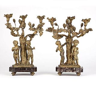 A complementary pair of three-light gilt bronze figural candelabra