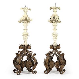 A pair of Continental carved wood and gesso pricket candlesticks