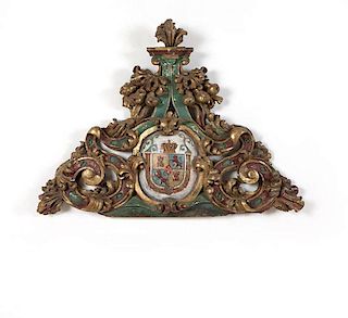 A Spanish carved and gilt wood pediment