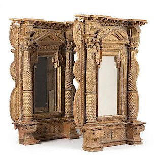 A pair of German carved gesso and gilt wood wall mirrors
