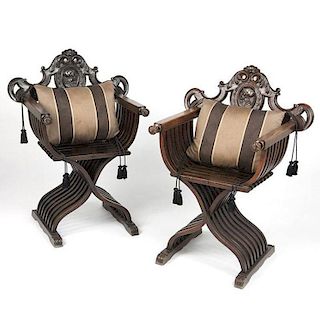 A pair of carved walnut Renaissance revival Savonarola chairs