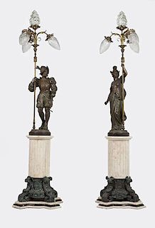 A pair of neoclassical four-light figural torchieres