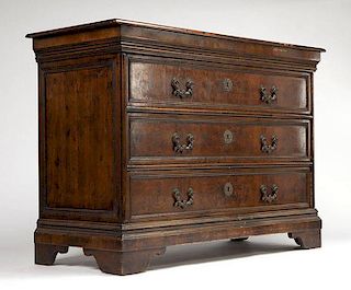 A Baroque style walnut chest of drawers