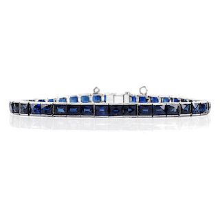 Vintage Sapphire and Platinum Line Bracelet. Sapphires with vivid saturation of color. Unsigned. Ve