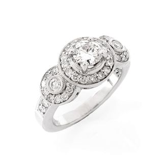 Approx. 1.40 Carat Diamond and 18 Karat White Gold Engagement Ring. Set in the center with a round 