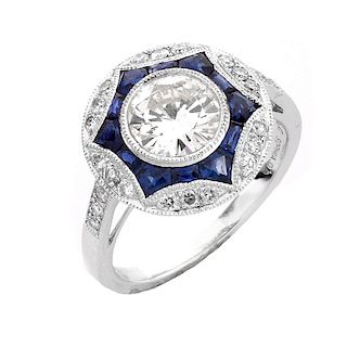 Art Deco style Approx. 1.20 Carat TW Diamond, .64 Carat Sapphire and Platinum Ring set in the Cente