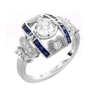 Art Deco style Approx. .86 Carat TW Diamond, .38 Carat Sapphire and Platinum Ring set in the Center
