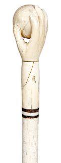 8. Hand and Ball Nautical cane - mid 19th C. – A very well carved whale’s tooth handle which is attached to the handle with a baleen plug, two baleen 