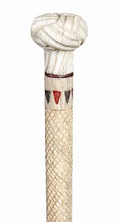 12. Scrimshaw Whale Bone cane - mid 19th C. – A carved whale bone Turk’s Knot handle, a baleen spacer, eight triangles which have been colored ¾” shaf