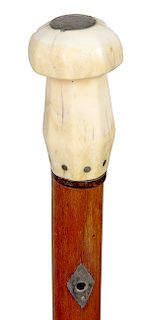 28. Whale’s Tooth Nautical Cane- Mid 19th Century- A carved whale’s tooth with a silver love token atop which is attached to the shaft with baleen, pa