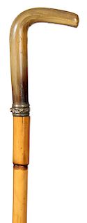 41. Horn Sword Cane- Ca. 1880- A horn handle with a brass collar and a push button mechanism which holds a 13” four-sided blade with some acid etching