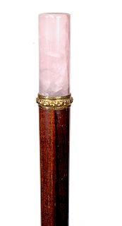 67. Rose Quartz Dress Cane- Ca. 1900- A beautiful rose quartz crystal with an ornate vermeil collar, rosewood shaft and a horn ferrule. H.- ¾” x 2” O.