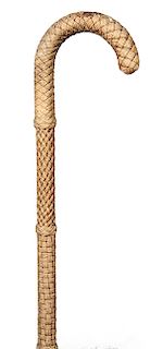 79. Nautical Macramé Cane- Ca. 1880- A sailor made woven and tied rope cane over a crook handle malacca, exceptional detail paid to different types of