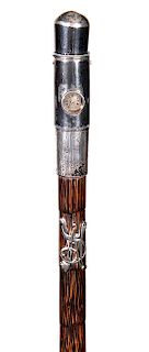 90. Watch Cane- Ca. 1900- A working watch cane which is probably a Houlska movement which was sold by Howell of London, the cane retains the original 