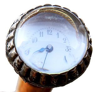 96. Ornate Silver Watch Cane- Ca. 1880- A Swiss made pocket watch cane with a very ornate silver chased handle which has a hinged and locking lid, the