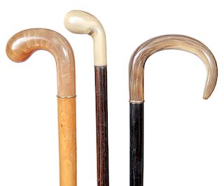 139. A group of Horn Dress Canes- early 20th century- All three are in fine condition, and all have horn ferrules, ebony-exotic wood-malacca shafts-av
