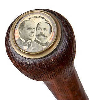 182. McKinley/Hobart Political Cane- Late 19th Century- A hardwood pommel one-piece shaft which has a jugate pin back button atop set in a brass bezel