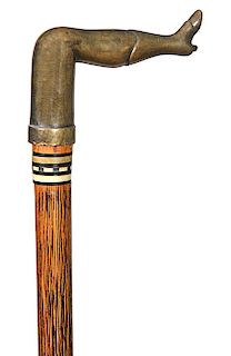 208. Bludgeon Cane- Late 19th Century- A bell bronze naughty leg “defensive cane” with a two color horn collar, partridgewood shaft and a horn ferrule
