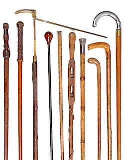 210. A Group of Ten Canes- Including horse measure, seat cane, folk art, lumber tool and compartment plus more. $500-$1,000