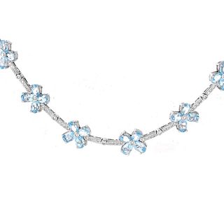 Contemporary Oval Cut Aquamarine, Round Brilliant Cut Diamond and 18 Karat White Gold Necklace.