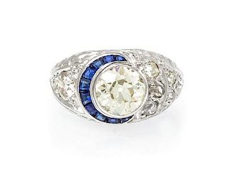 An Art Deco Platinum, Diamond and Synthetic Sapphire Ring, 5.40 dwts.