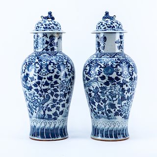 Pair of Mid Century Chinese Blue and White Porcelain Covered Urns with Foo Dog Finial. 