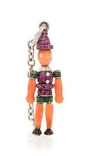 An 18 Karat White Gold, Carved Coral, Diamond, Ruby and Emerald Articulated Pinocchio Ring/Pendant, Michele della Valle, 3.20 dw