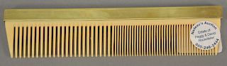 Rockefeller 10 karat gold handled comb. length 7 1/4 inches. 

Provenance: Estate of Peggy & David Rockefeller having stamp/label.