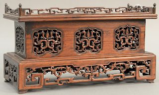 Chinese hardwood altar table top stand with reticulated carved gallery. height 7 1/2 inches, width 13 1/2 inches.   Provenance:...