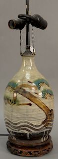 Asian earthenware glazed bottle having green blue enameled caterpillar with anchor and wavy decorated base with overall white wash g...