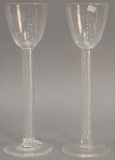 Pair of tall Steuben crystal toasting glasses with air twist stems, one monogrammed "DR" and the other monogrammed "MR", both signed...